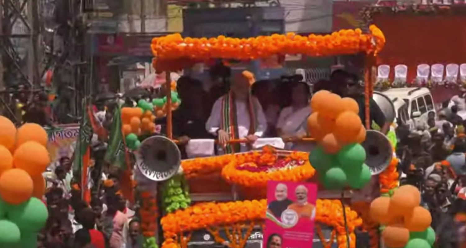 Amit Shah addresses a roadshow in Malda