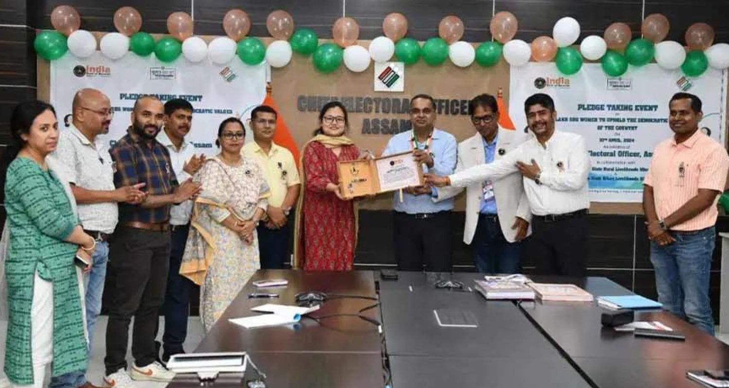 The India Book of Records adjudicator Narvijay Yadav presente the certificate to the Assam Chief Electoral Officer Anurag Goel.