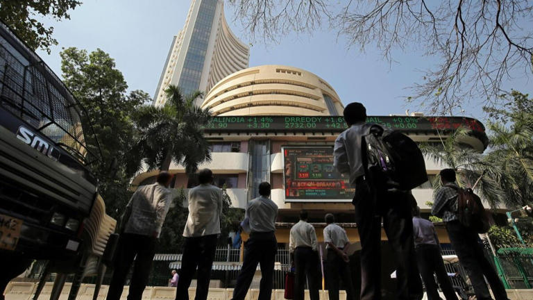 Benchmark stock market indices dropped after the RBI Governor announced that the Monetary Policy Committee (MPC) decided to keep the key interest rates unchanged.