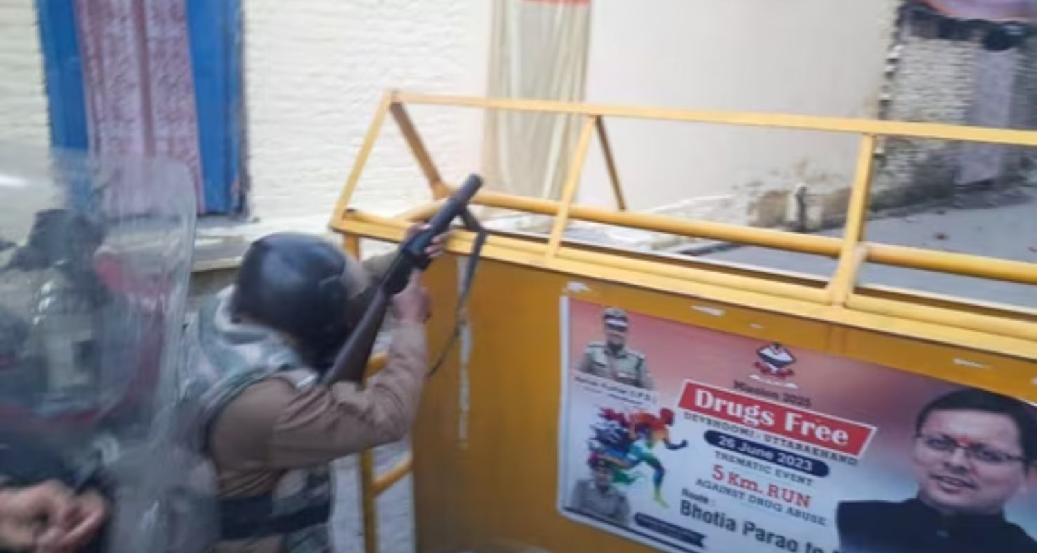 Security personnel at the site after a group of protestors hurled stones and set vehicles on fire, over the demolition of an "illegally built" madrasa at Banbhoolpura area, in Haldwani.