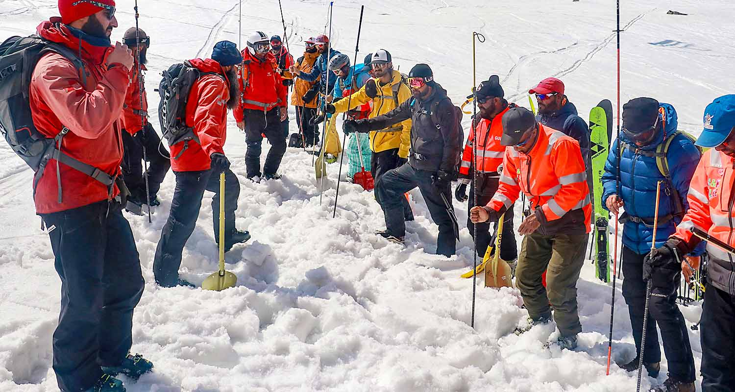 Personnel of Indian Army ski patrol team, J&K Police rescue team, local ski guides and the tourism department take part in a snow avalanche rescue exercise drill