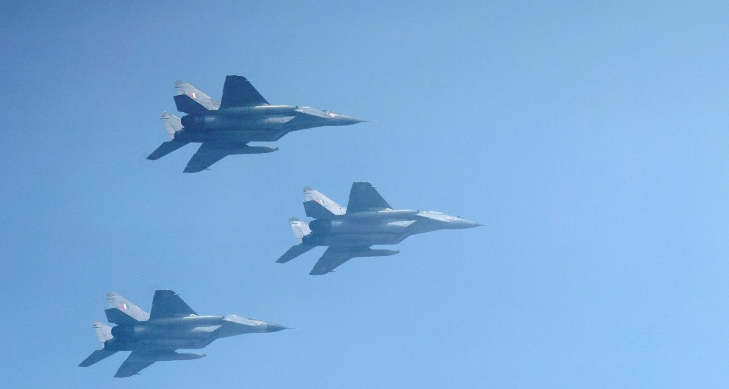 three rafale aircraft in the sky flying in formation above new Delhi, 
