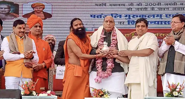 Defence Minister Rajnath Singh on Saturday said Macaulay was sent to India to throttle the country's traditional system of education and enslave Indians mentally colonising their minds  Yoga Guru Ramdev Uttarakhand Chief Minister Pushkar Singh Dhami