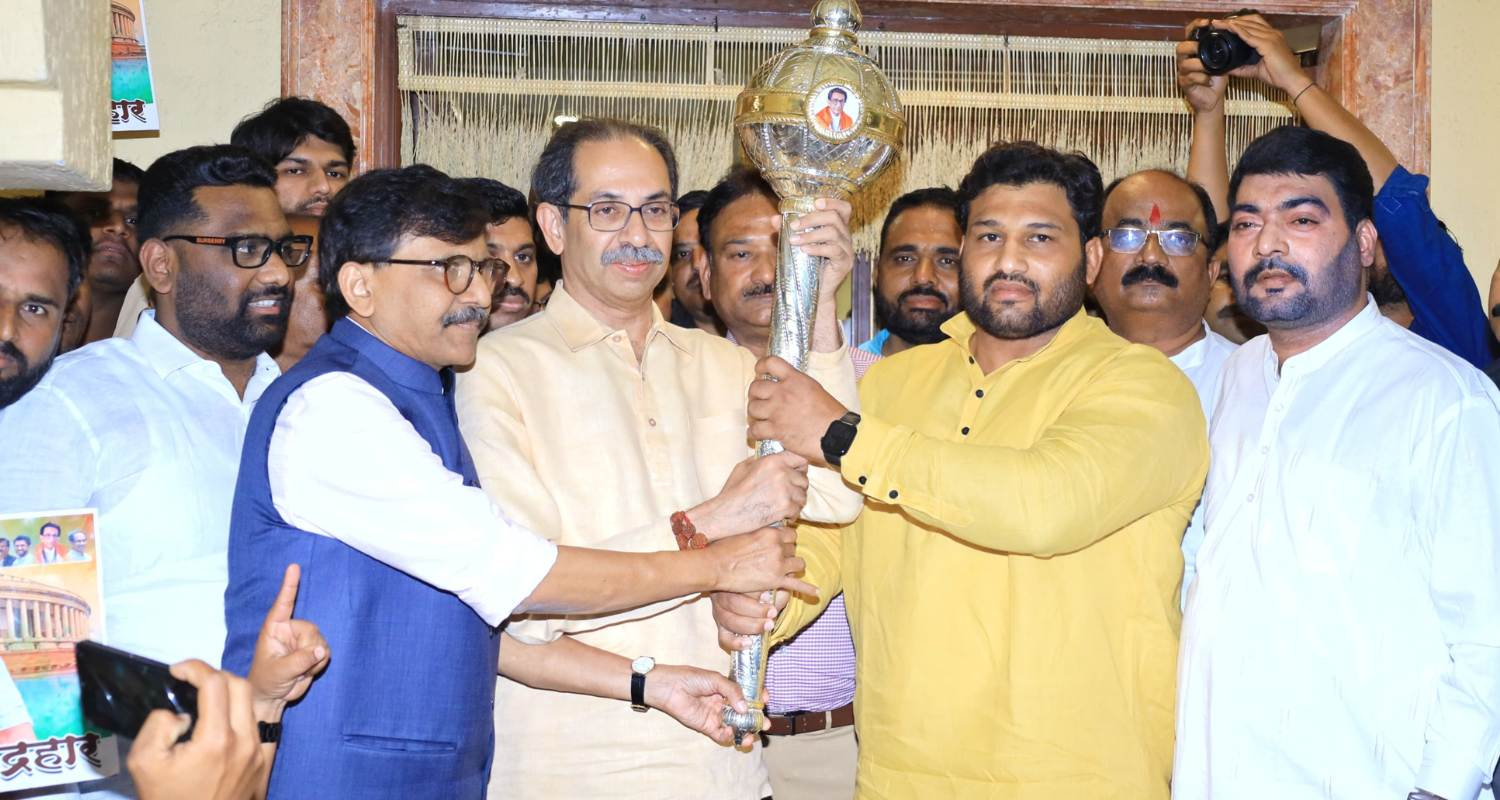 Wrestler Chandrahar Patil with Uddhav Thackeray. 