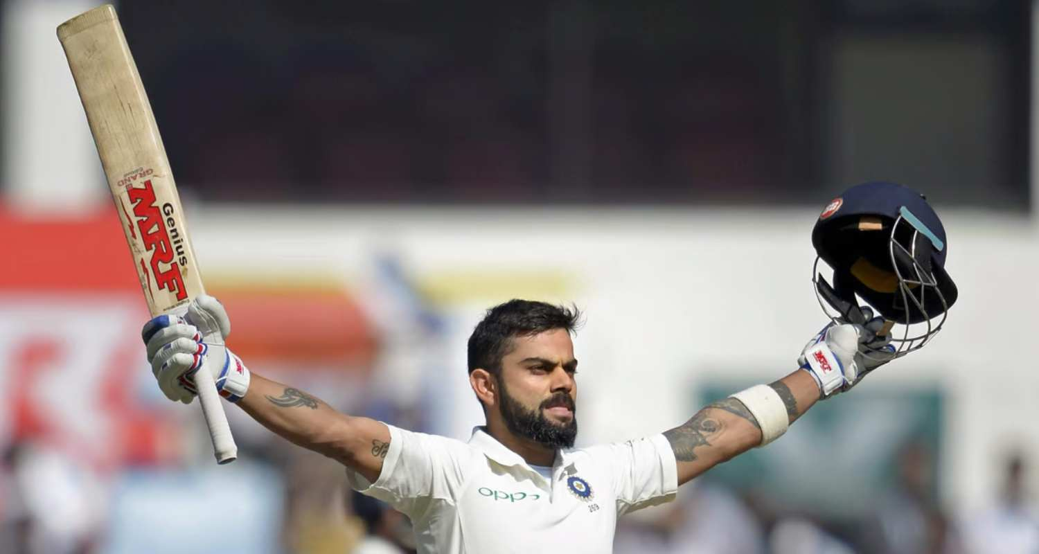 Virat Kohli celebrates a century 