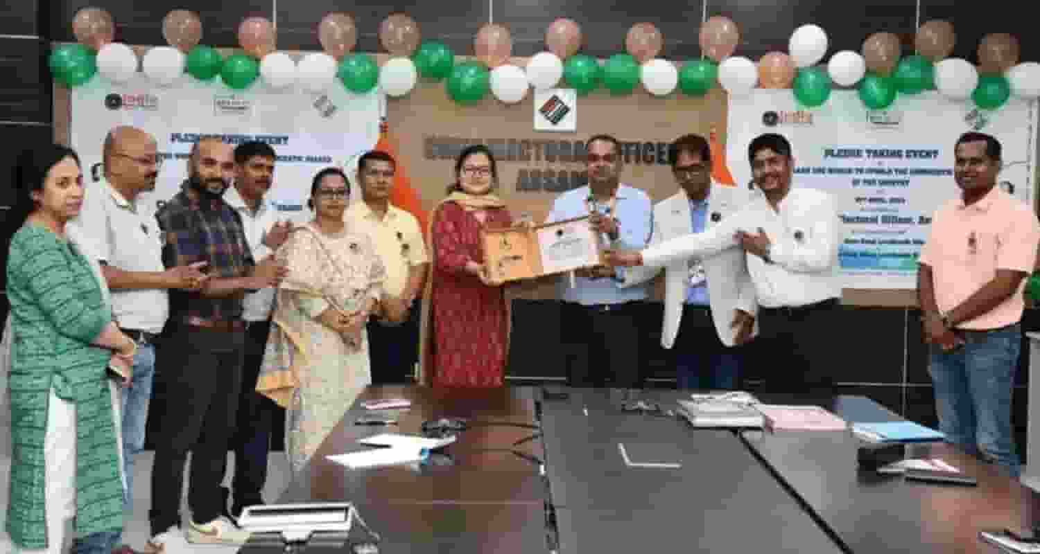 The India Book of Records adjudicator Narvijay Yadav presente the certificate to the Assam Chief Electoral Officer Anurag Goel.