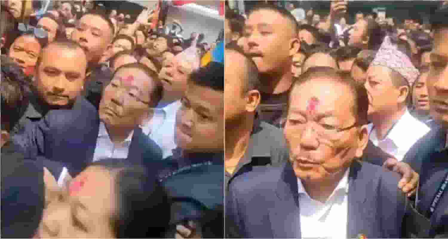 The picture depicts Chamling campaigning amid a crowd approaching the vicinity.