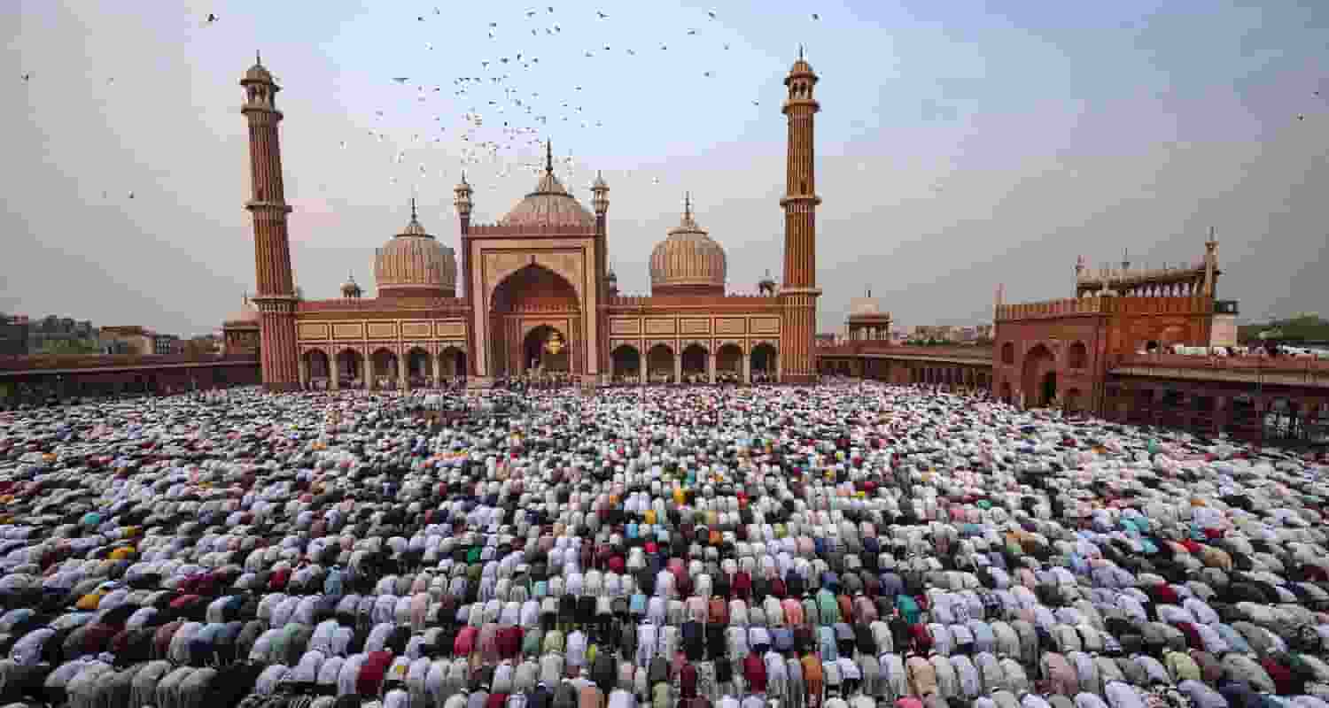  Muslim devotees offer 'namaz' during Eid-ul-Fitr celebrations, at Jama Masjid, in New Delhi, Thursday
