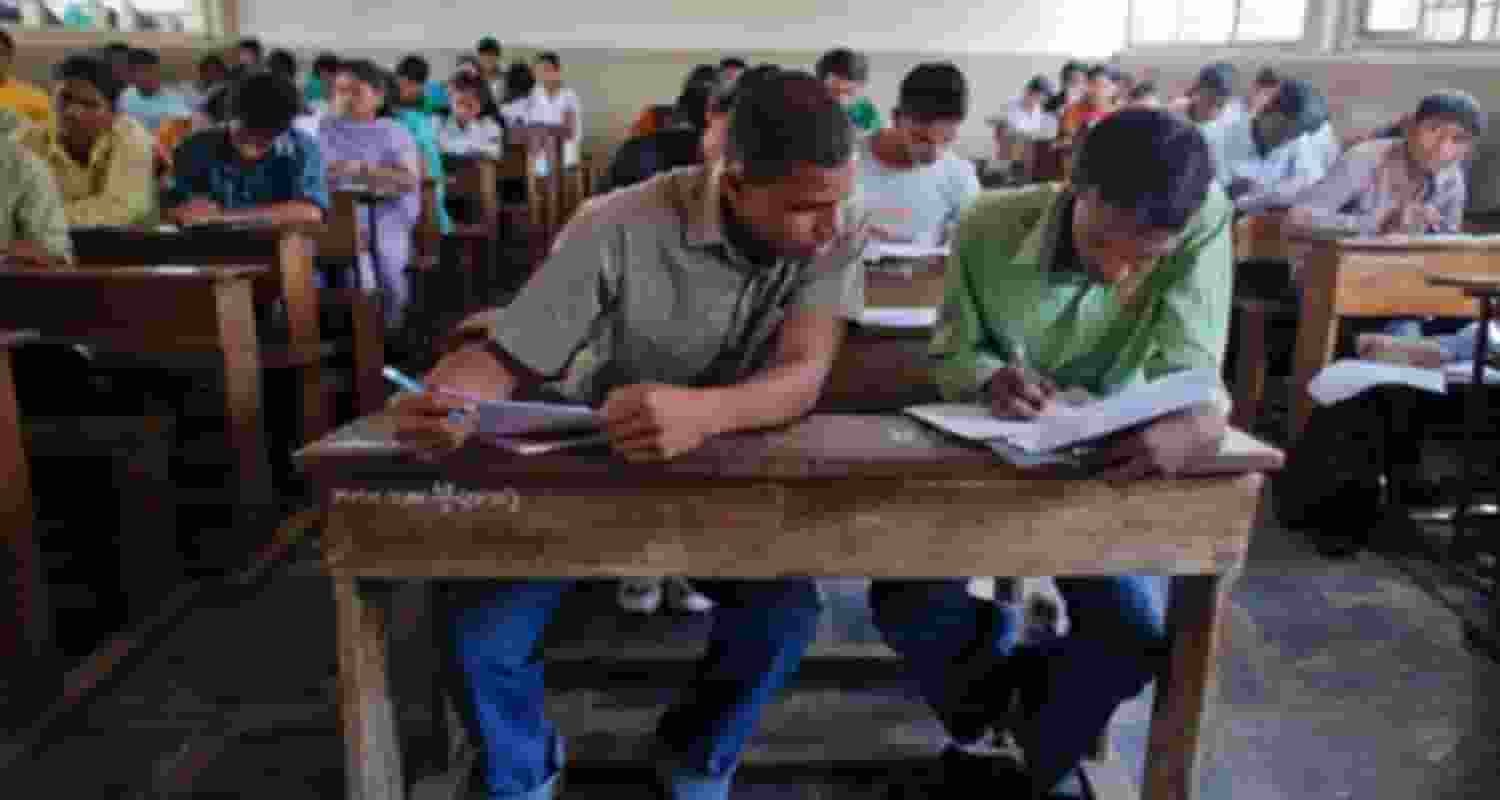 Students cheating in an exam.