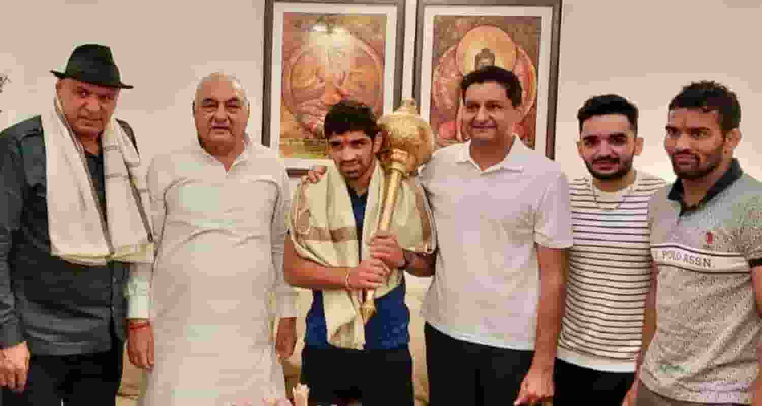 Bhupinder Hooda and Deepender Hooda with Olympic medalist wrestler Aman Sehrawat. 