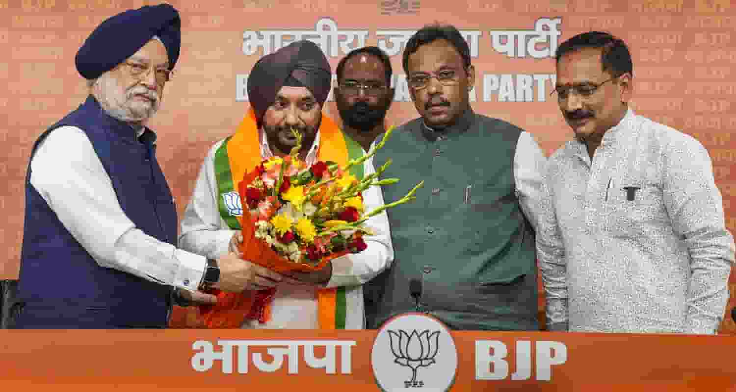 Former Congress leader Arvinder Singh Lovely being felicitated by Union Minister Hardeep Singh Puri, Delhi BJP President Virendra Sachdeva and BJP National General Secretary Vinod Tawde after joining the party, ahead of the third phase of Lok Sabha elections, in New Delhi on Saturday.