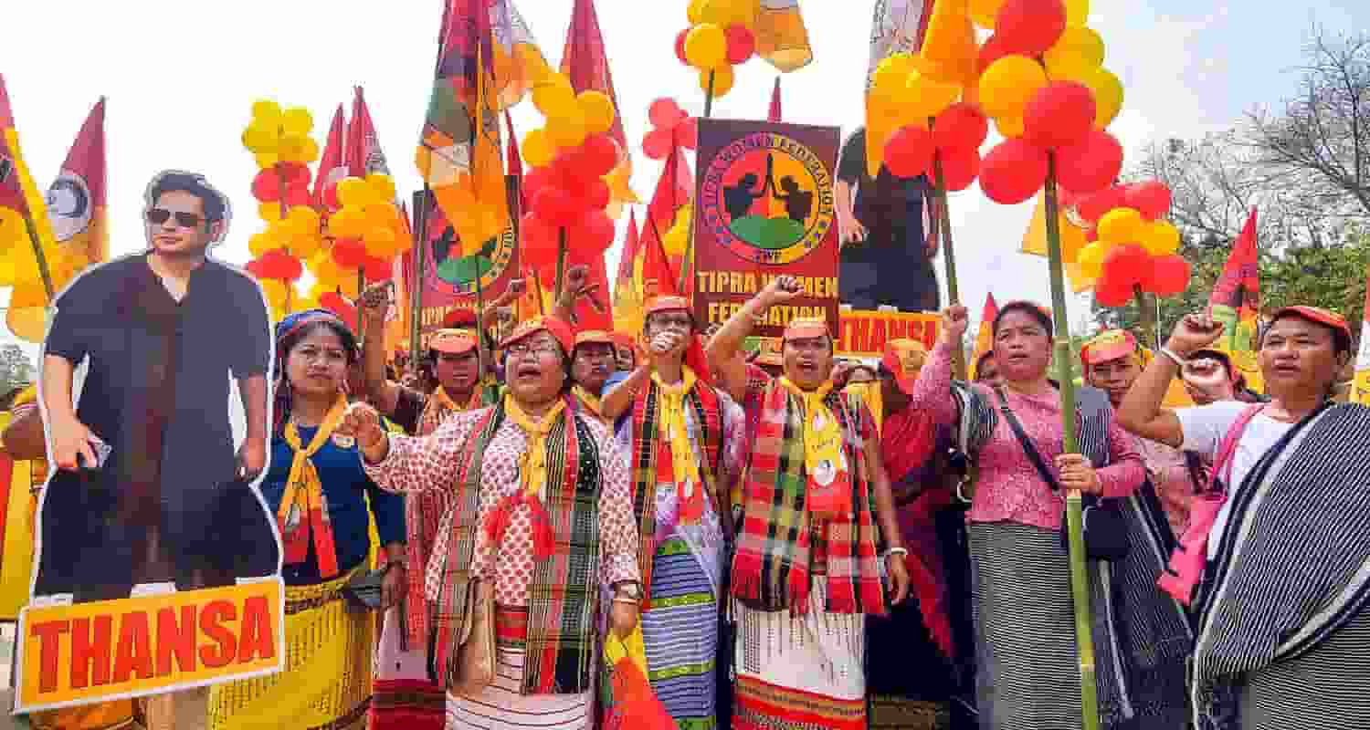 Tipra Motha Party (TMP) supporters raise slogans during NDA candidate for East Tripura Parliamentary constituency Kriti Devi Singh Deb Barman's nomination filing procession, in Agartala, Thursday.