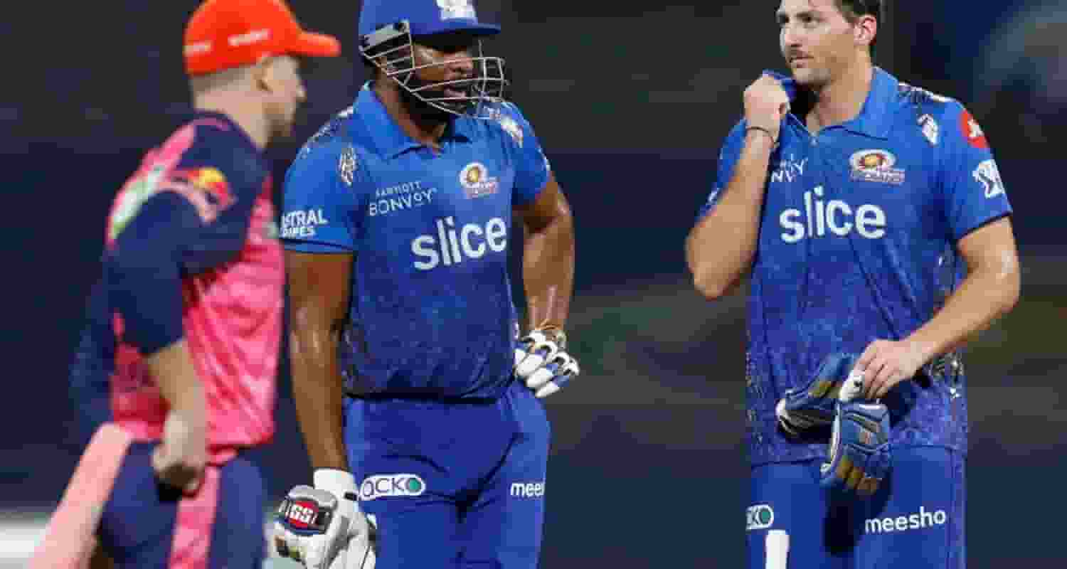 MI batting coach Kieron Pollard (left), batter Tim David (right).