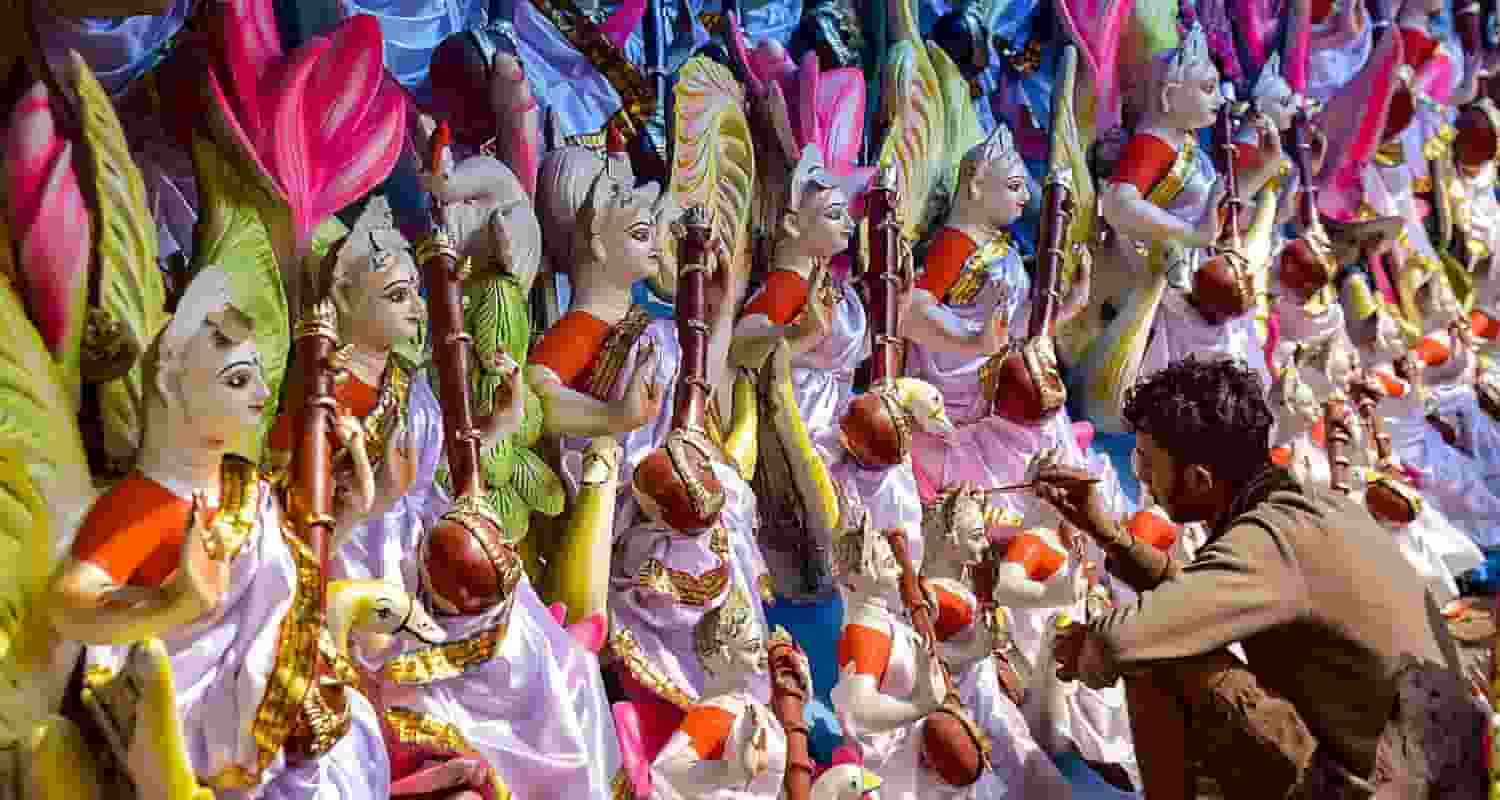 Welcoming the goddess of Knowledge: An artisan gives finishing touches to an idol of Goddess Saraswati ahead of the ‘Saraswati Puja’ festival, in Guwahati, on Tuesday.