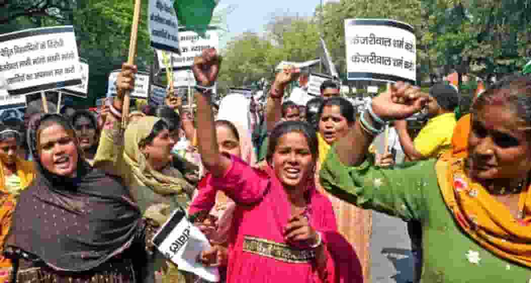 Hindu refugees from Pakistan stage protest outside Delhi CM Arvind Kejriwal's residence over his remarks on CAA, in New Delhi on Thursday.