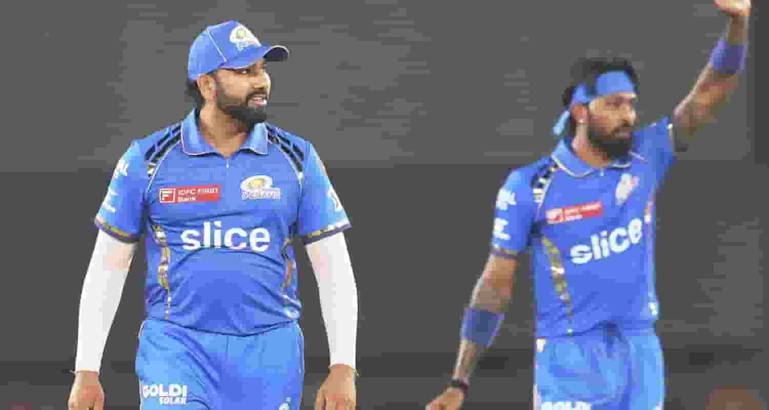 Former Mumbai Indians captain Rohit Sharma with the new skipper Hardik Pandya.