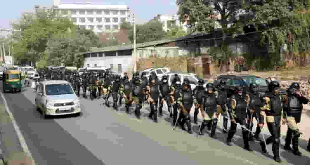 Haryana Police personnel conduct a march near Rajiv Chowk as part of preparations for the farmers' tractor rally in Gurugram. File Photo.