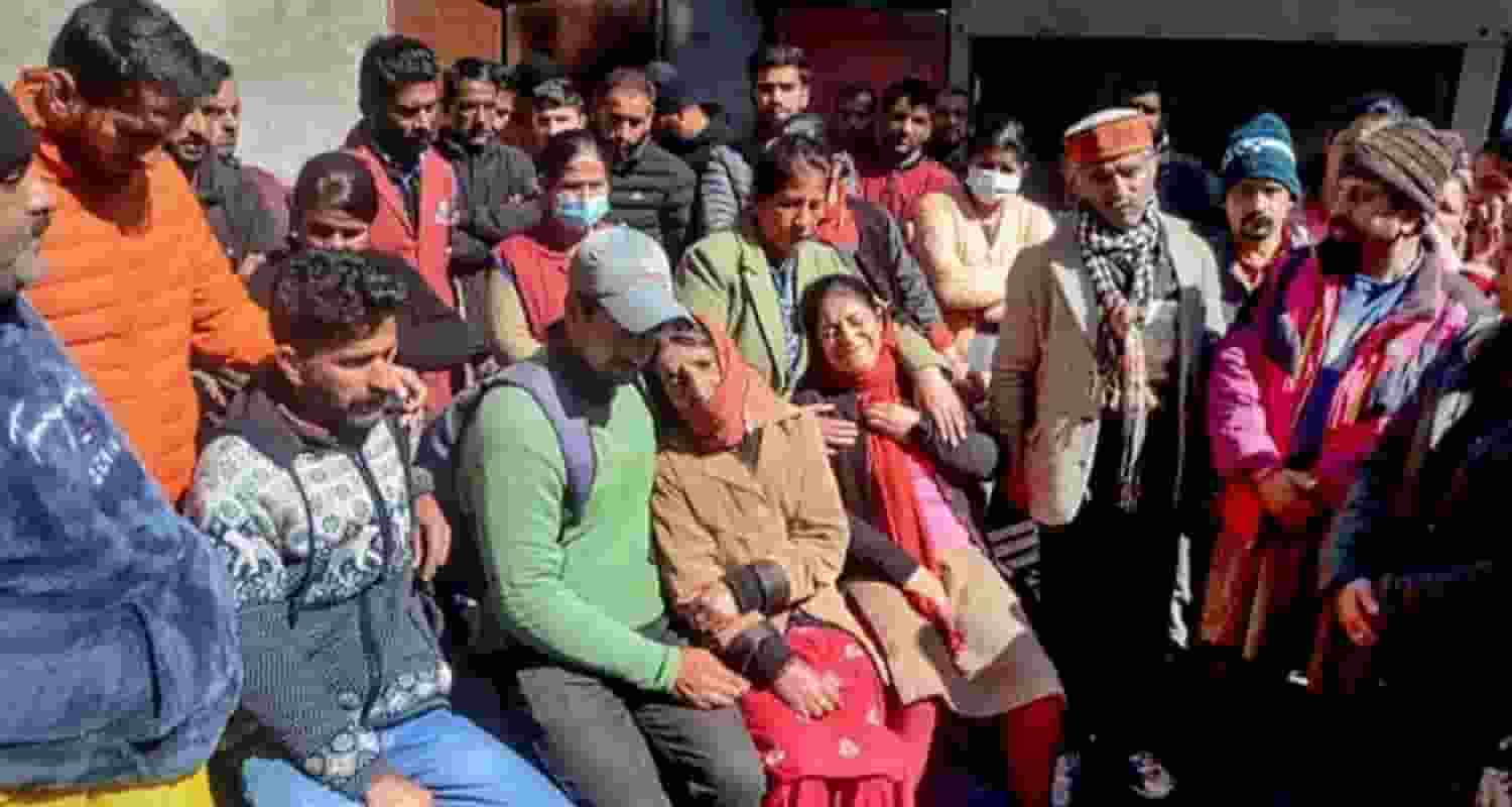Family members of a 21-year-old boy mourn at IGMC Hospital, who was killed by an unknown person, at Mall Road in Shimla.
