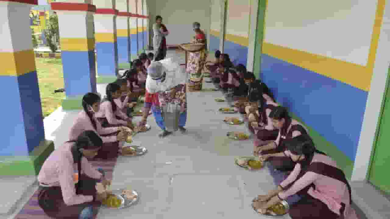 students having mid day meal at school